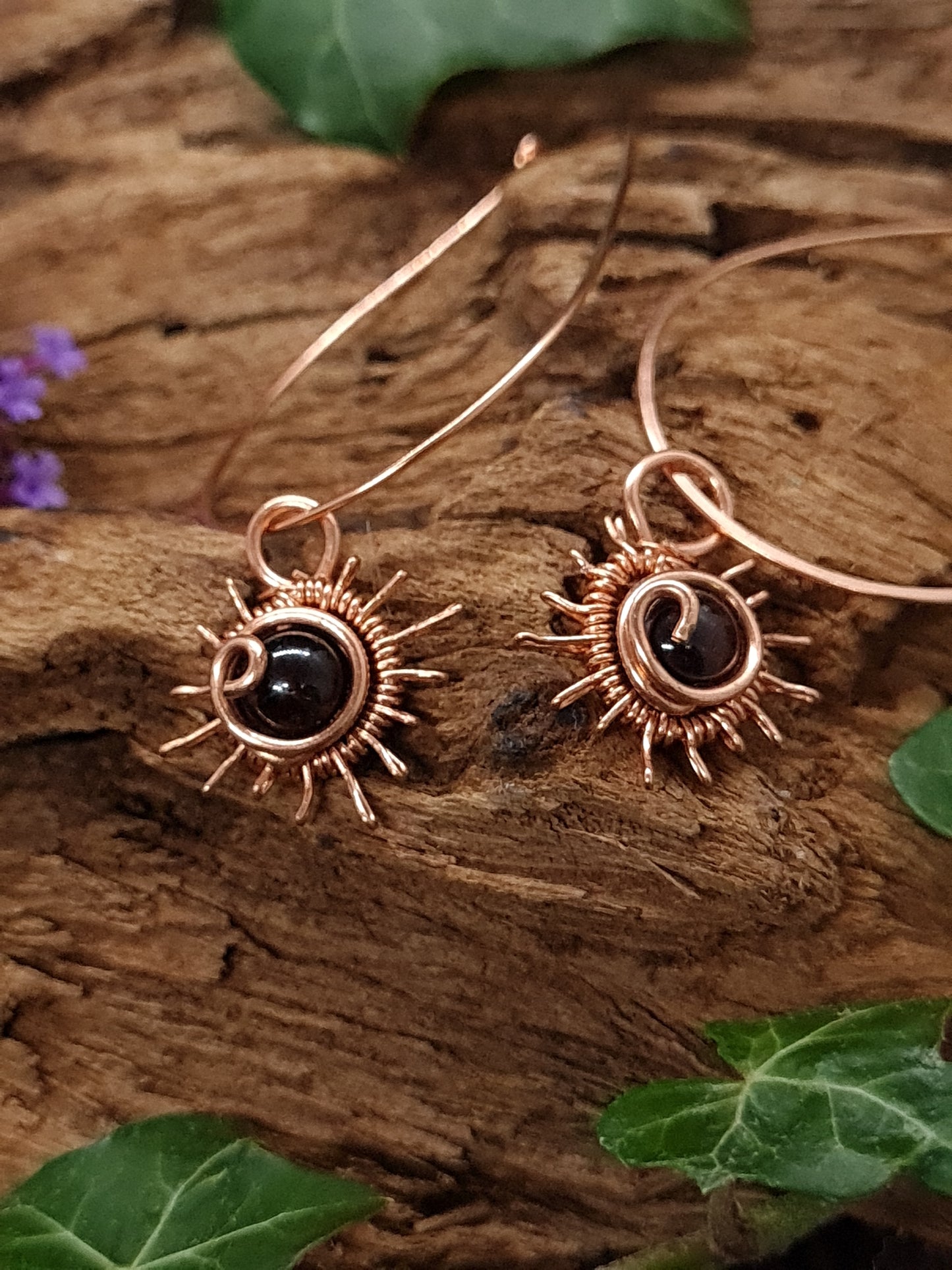 Copper hoops with sun design and Garnet stones