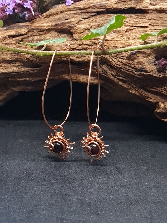 Copper hoops with sun design and Garnet stones